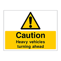 Caution Heavy vehicles turning ahead sign