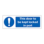 This door to be kept locked in port (Marine Sign)