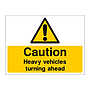 Caution Heavy vehicles turning ahead sign